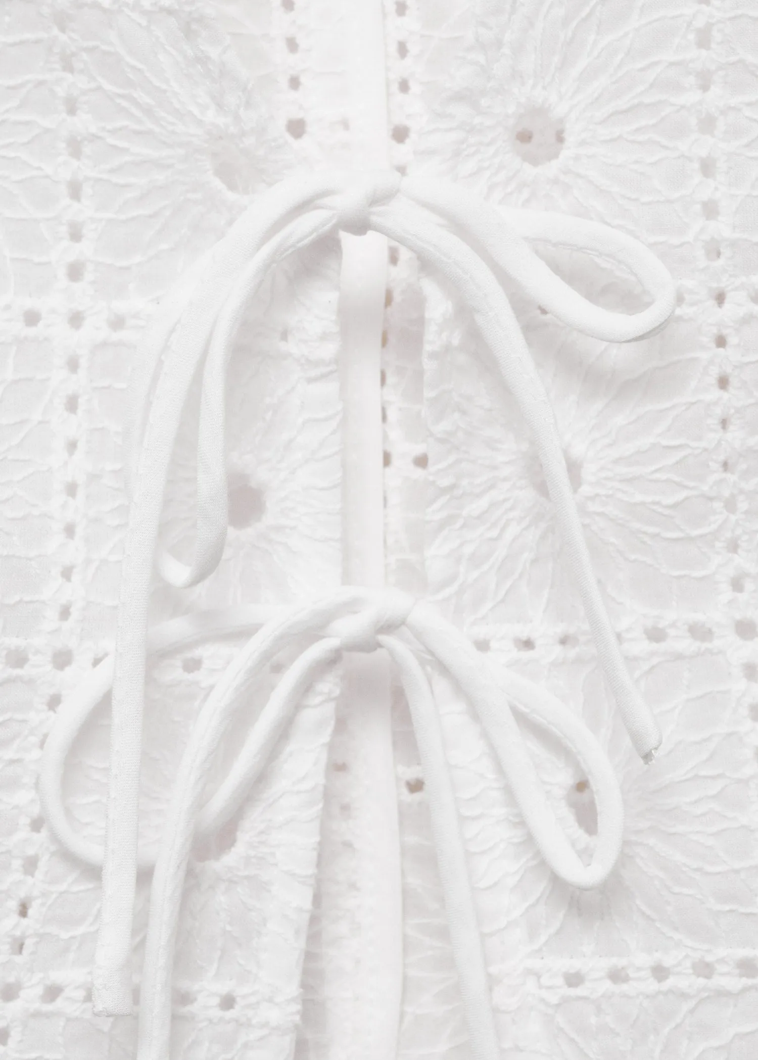 Embroidered cotton waistcoat with bows